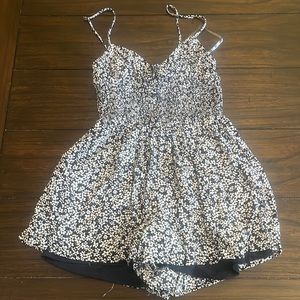 navy blue tillys floral romper size xs.